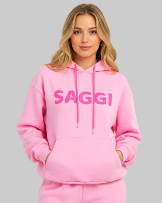 Model wearing pink SAGGI heavyweight graphic hoodie with fuchsia logo and fuchsia drawstrings, true-to-size fit.