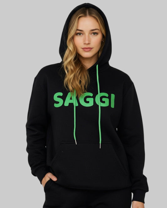 Model wearing black SAGGI heavyweight graphic hoodie with green logo and green drawstrings, true-to-size fit.